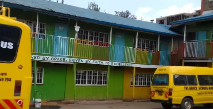 Multi-story school building with green and yellow walls